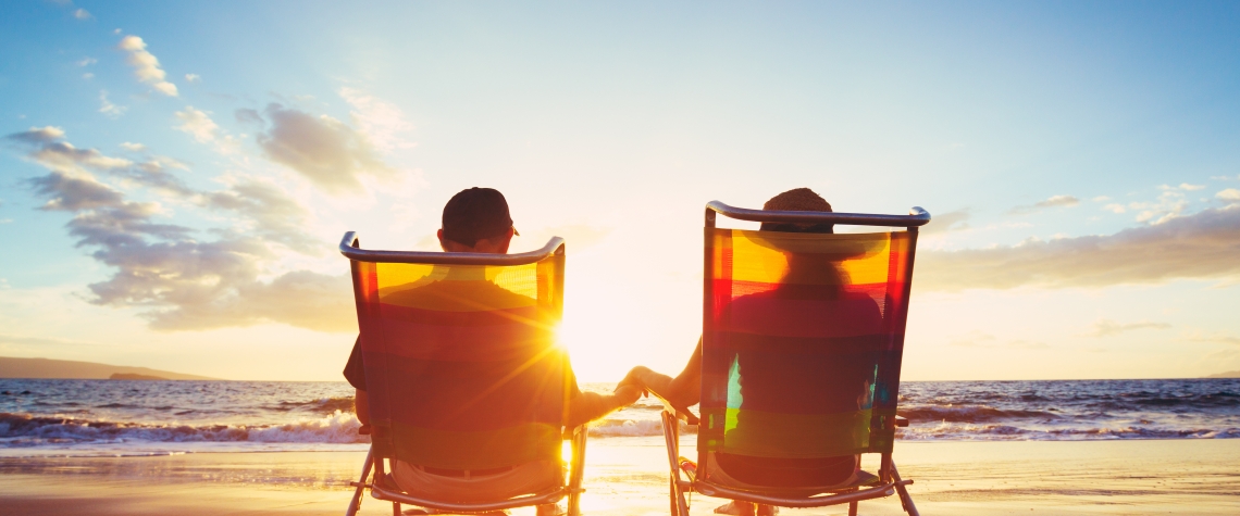 Retirement Vacation Concept, Mature Coupe Watching the Sunset Retirement Vacation Concept, Mature Coupe Watching the Sunset