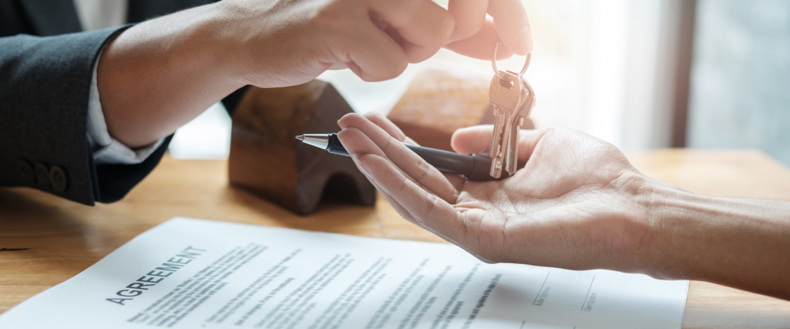 An ENB banker hands a client keys