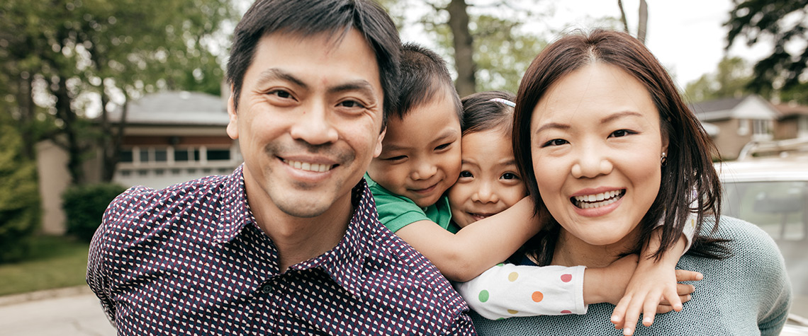 A mother and father with two children