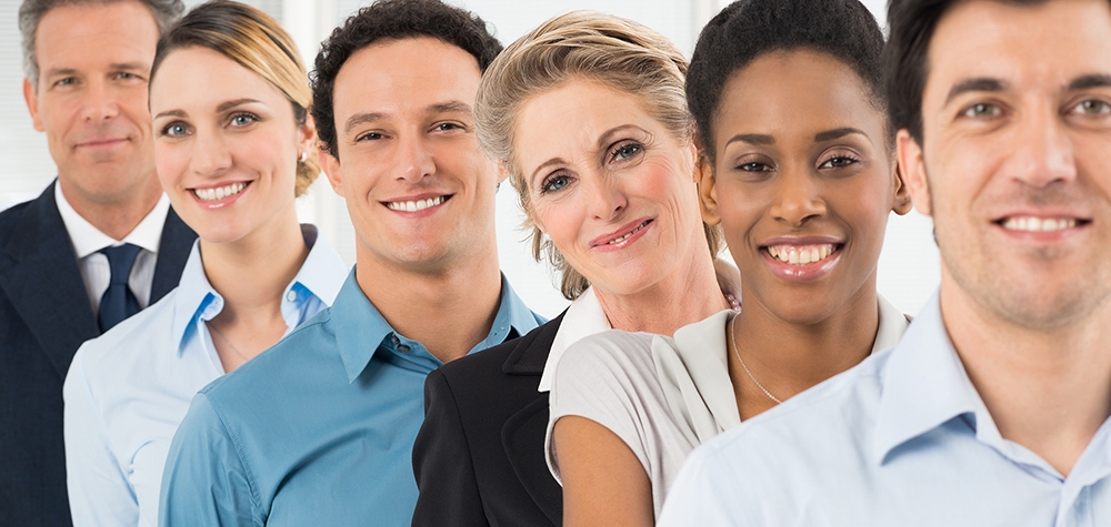 Group Of Happy Multiracial Businesspeople Standing In Row