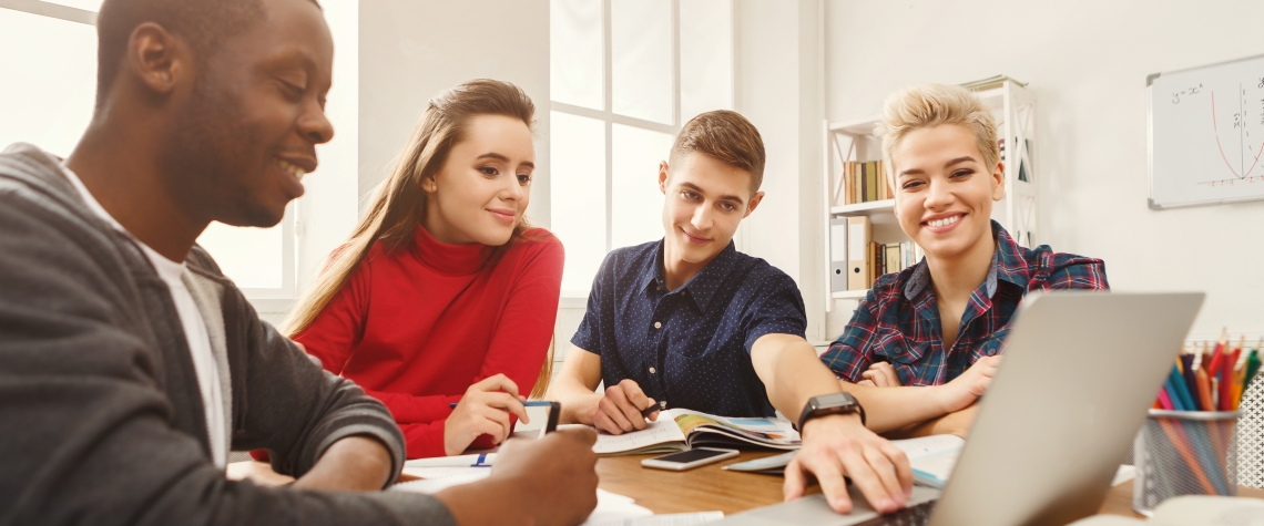 Multiethnic university students studying together.