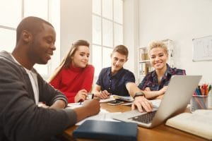 Multiethnic university students studying together.