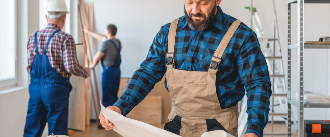 Contractor Checking a Blueprint