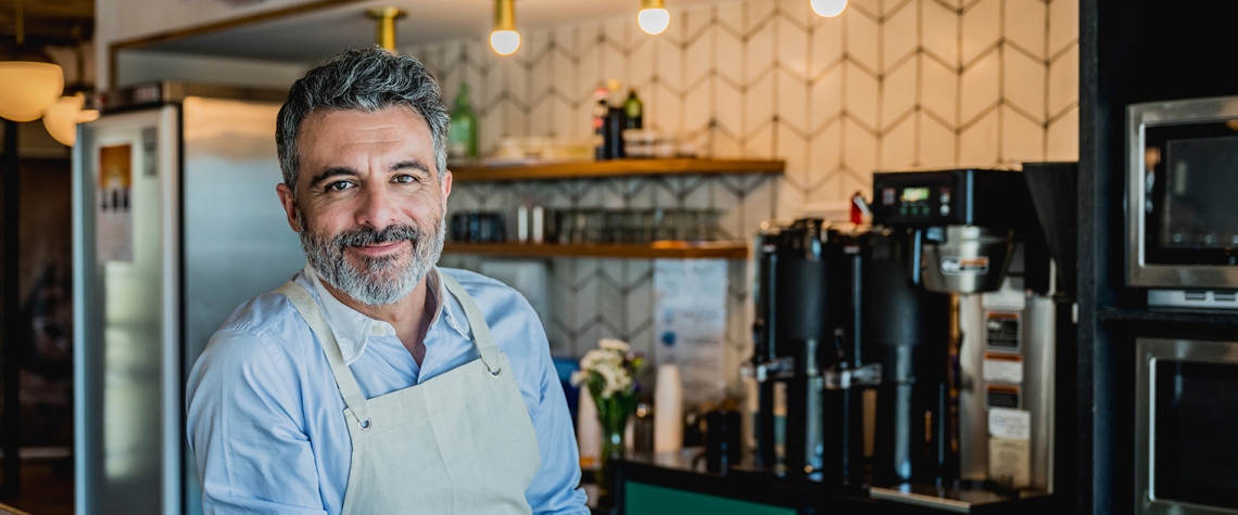 Cafe owner behind the counter