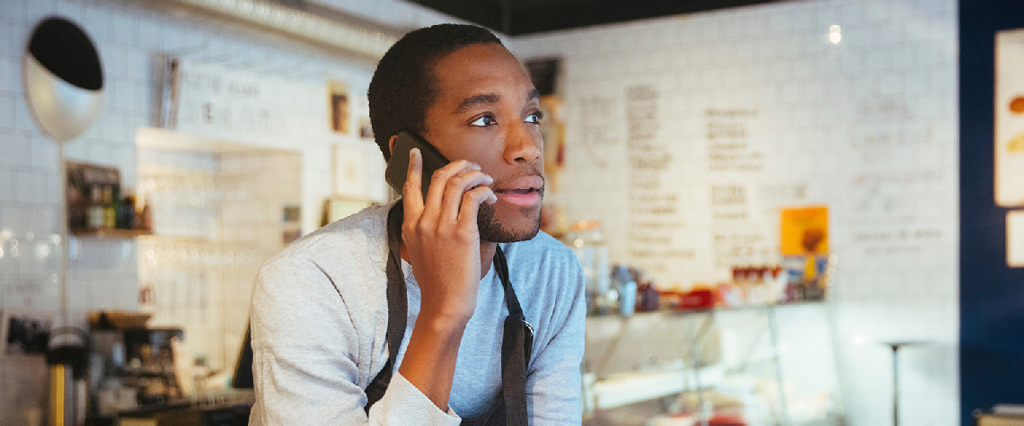 Shop owner on the phone