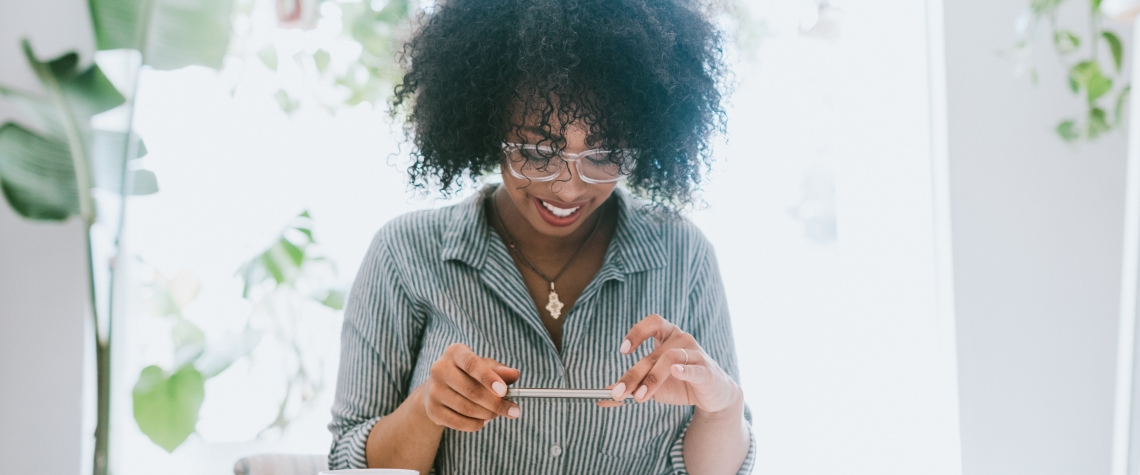 Woman using cellphone to take a mobile image