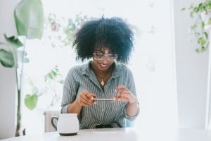 Woman using cellphone to take a mobile image