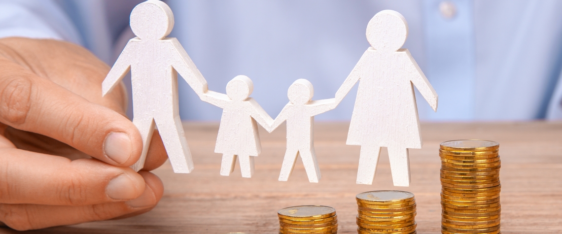 Budget of the family. Coins pile and the symbol of the family with the pope, mother, daughter and son