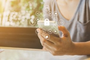 Woman using smartphone with icon graphic cyber security network of connected devices and personal data information