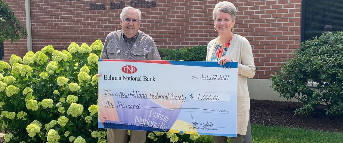 Members of the New Holland Historical Society receiving a check from ENB