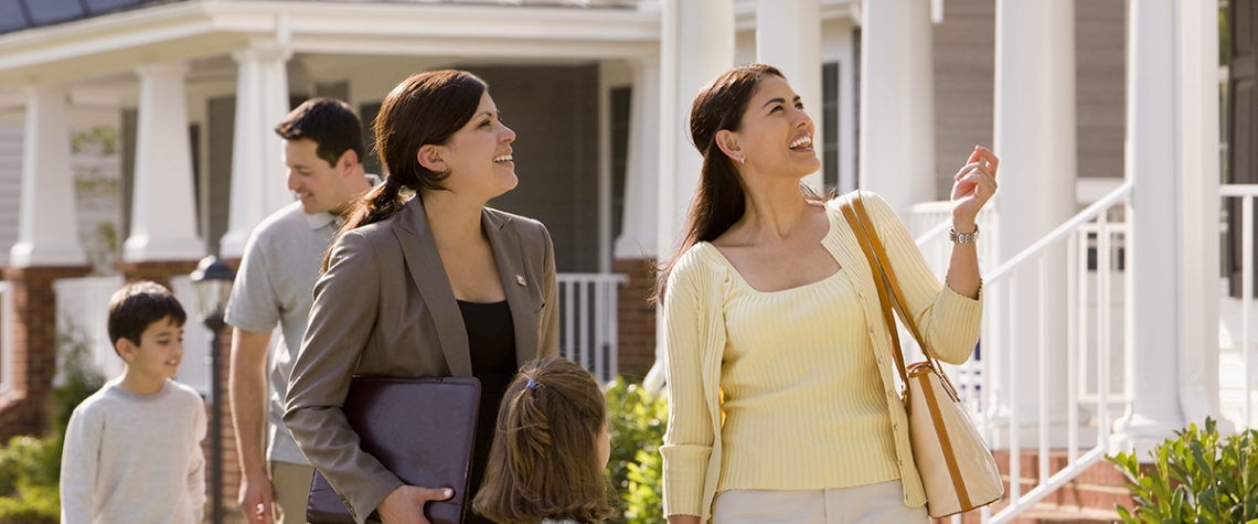 Relator Showing House to Young Family