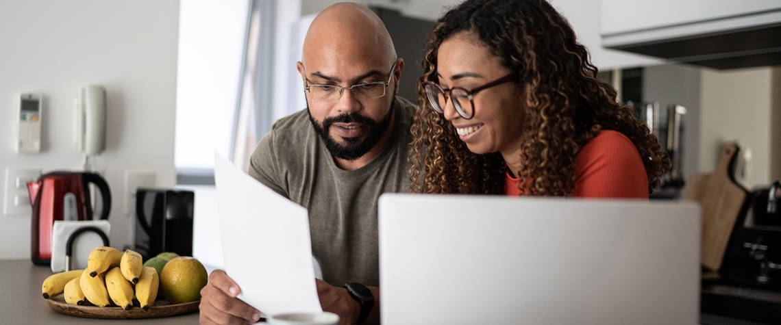 Couple doing home finances together at home