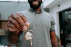 Man holding keys to his new home