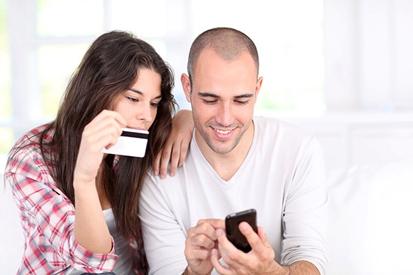 Couple looking at cell phone