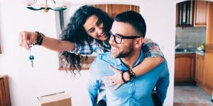 Husband and Wife with keys to their new home