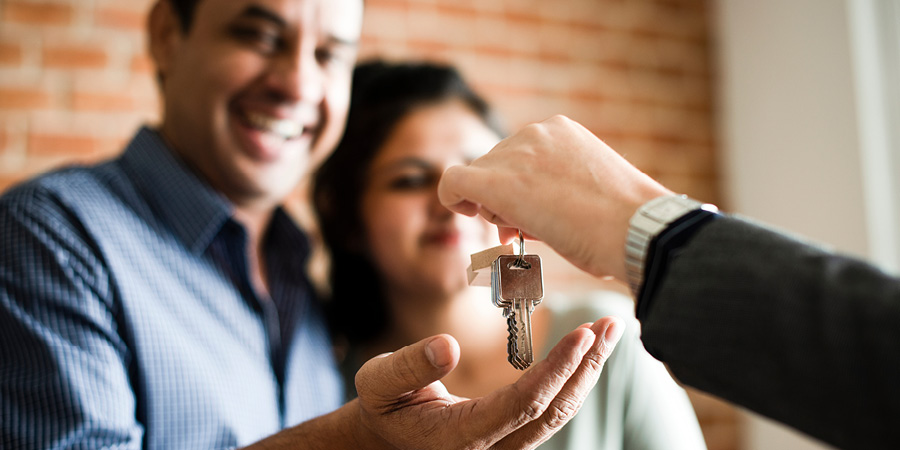 Couple getting Keys to their new home
